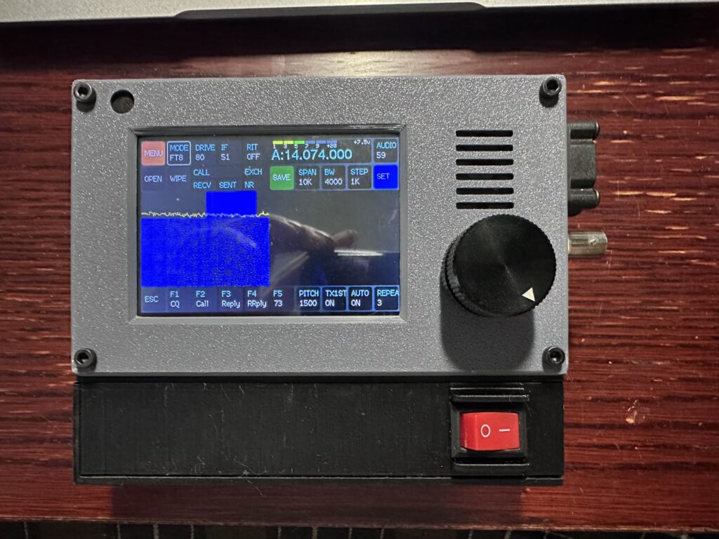 Picture showing a zBitx radio with an alternative 3D printed case that features an external on/off switch and fan